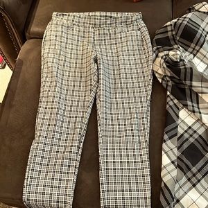 Black and white fitted pants can wear under boots